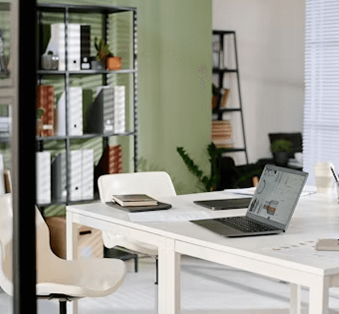 Minimal modern workspace with desk, laptop, and office setup representing productivity and organized workflow