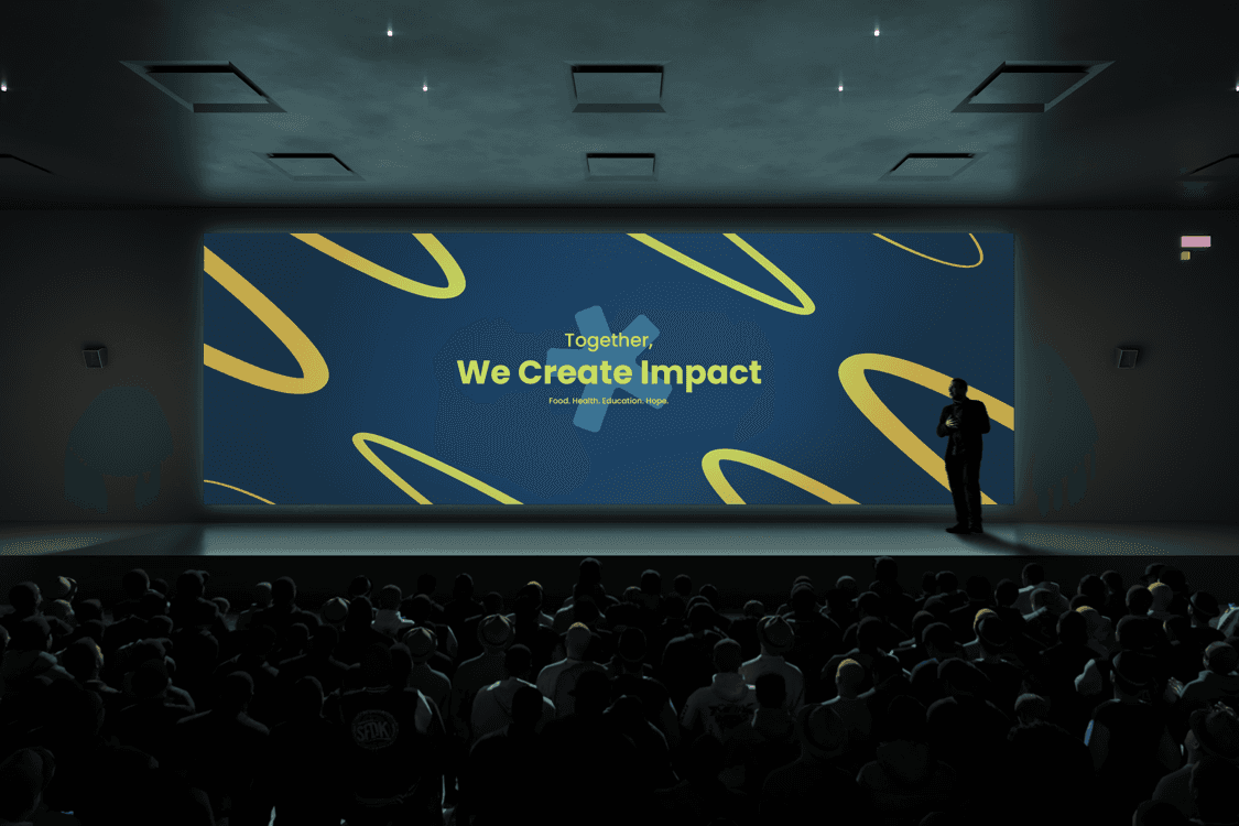 Trillioni Foundation stage presentation with large screen displaying tagline ‘Together, We Create Impact.’ Modern non-profit identity design for humanitarian work.