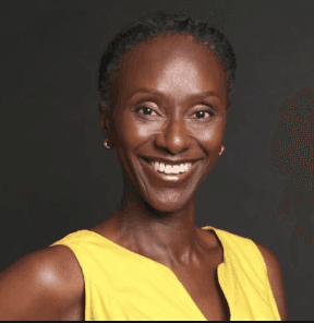 smiling woman wearing white and black pinstriped collared top