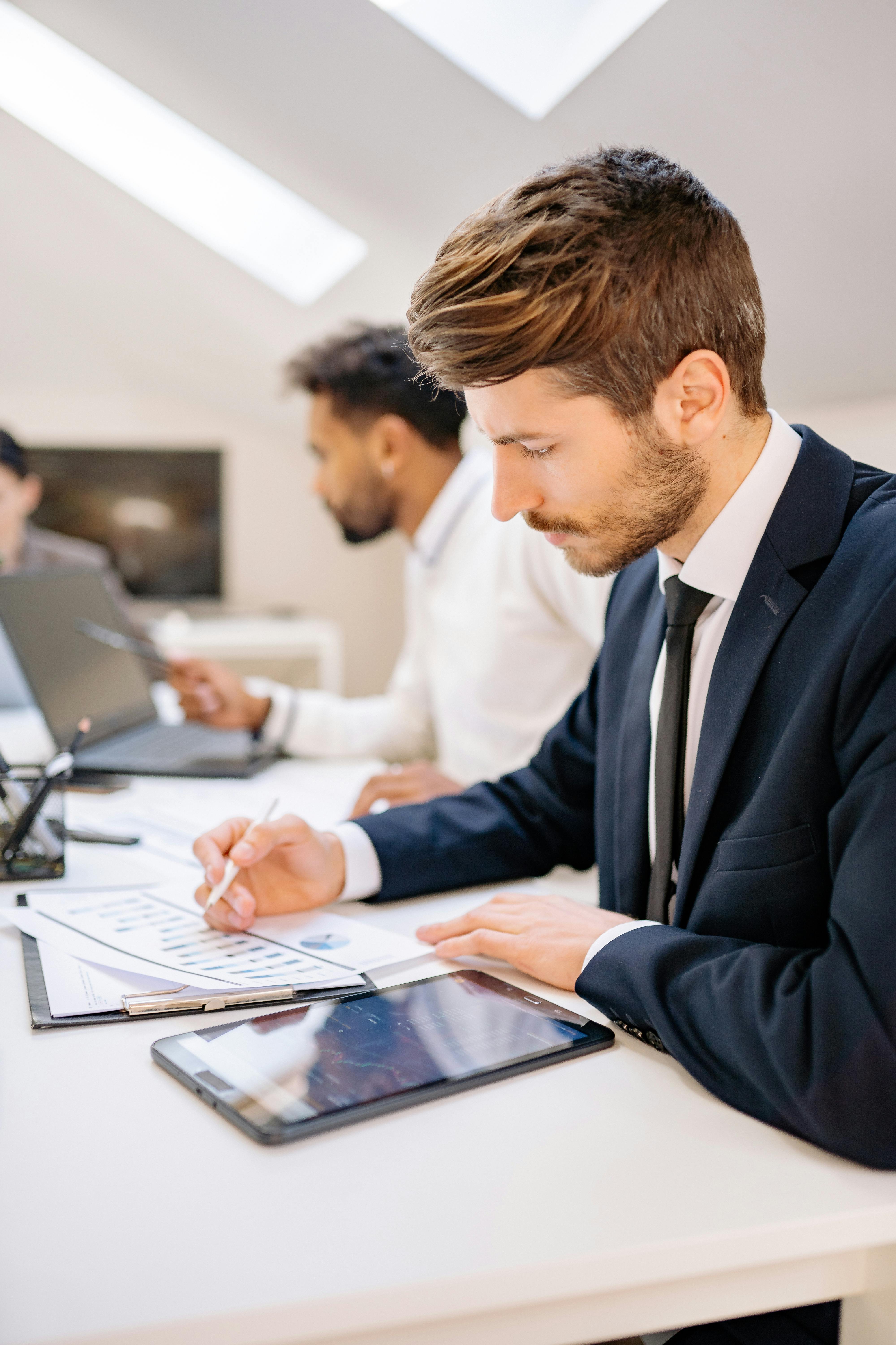 man sitting beside woman looking at a contract on DocuSign