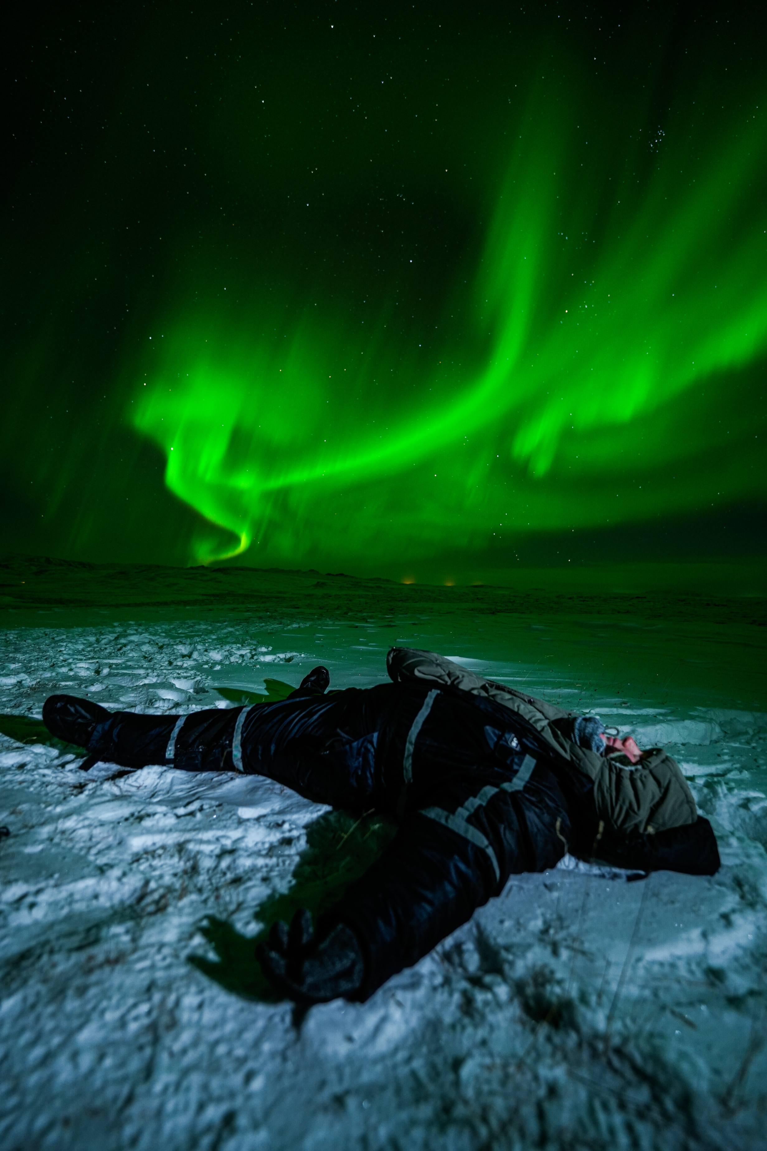 Northern Lights tour photography from Aurora Experts in Iceland, featuring guests beneath the aurora, winter landscapes, and vivid skies over remote Icelandic locations.