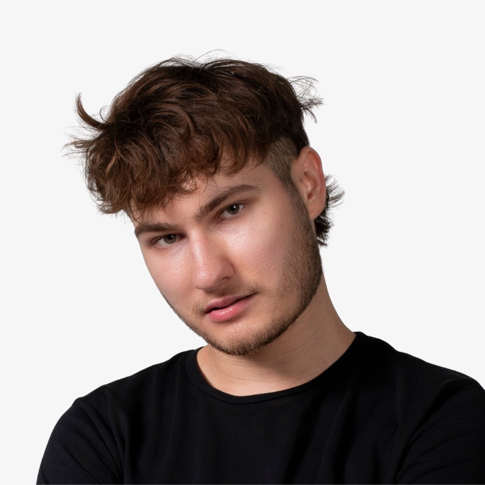A portrait of a young man smiling