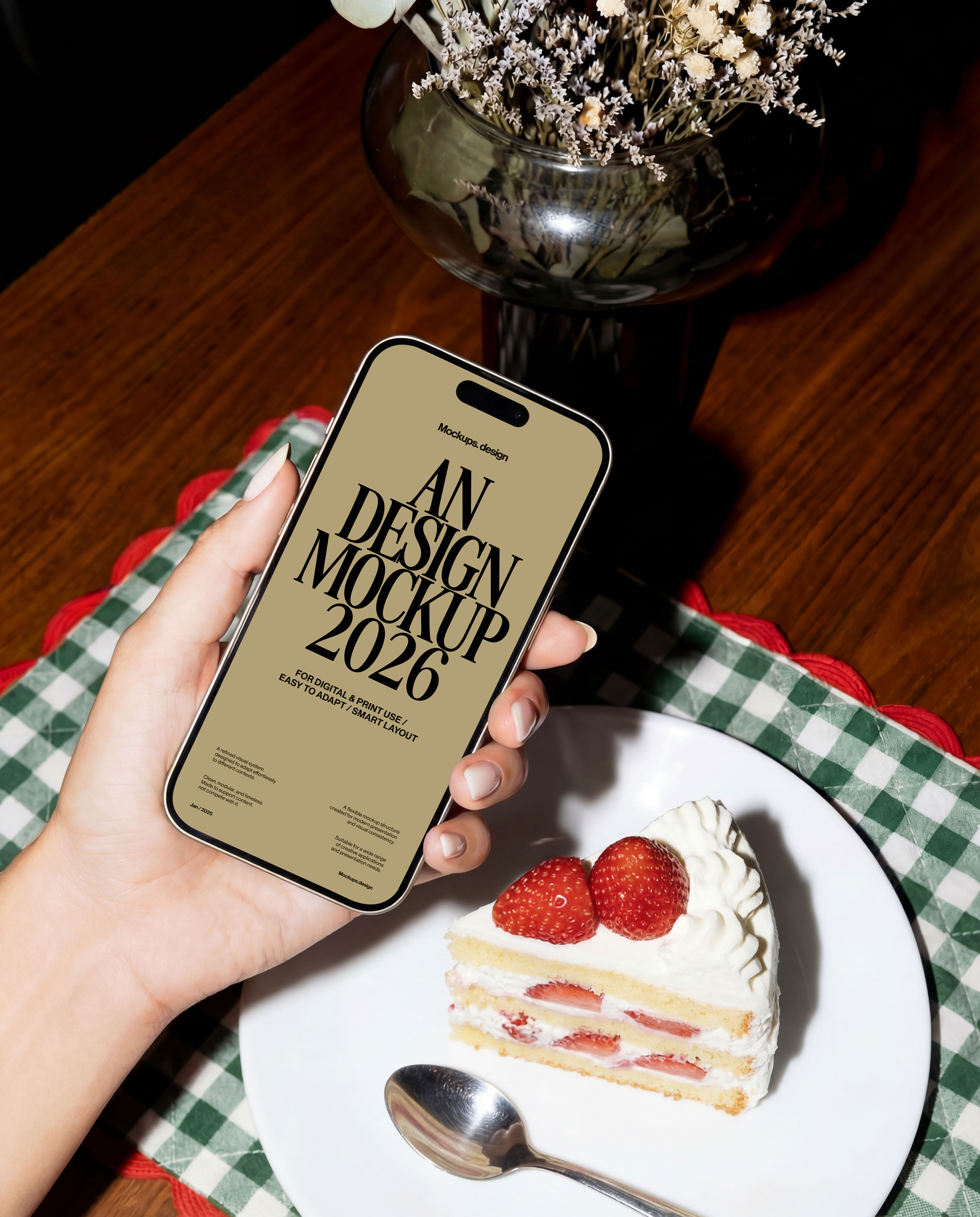 Hand holding iPhone mockup in restaurant setting