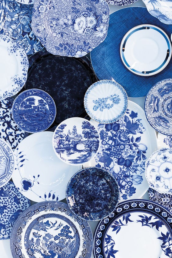 A close-up of a pink cocktail in a martini glass, set against a nighttime background with soft, blurred colors.