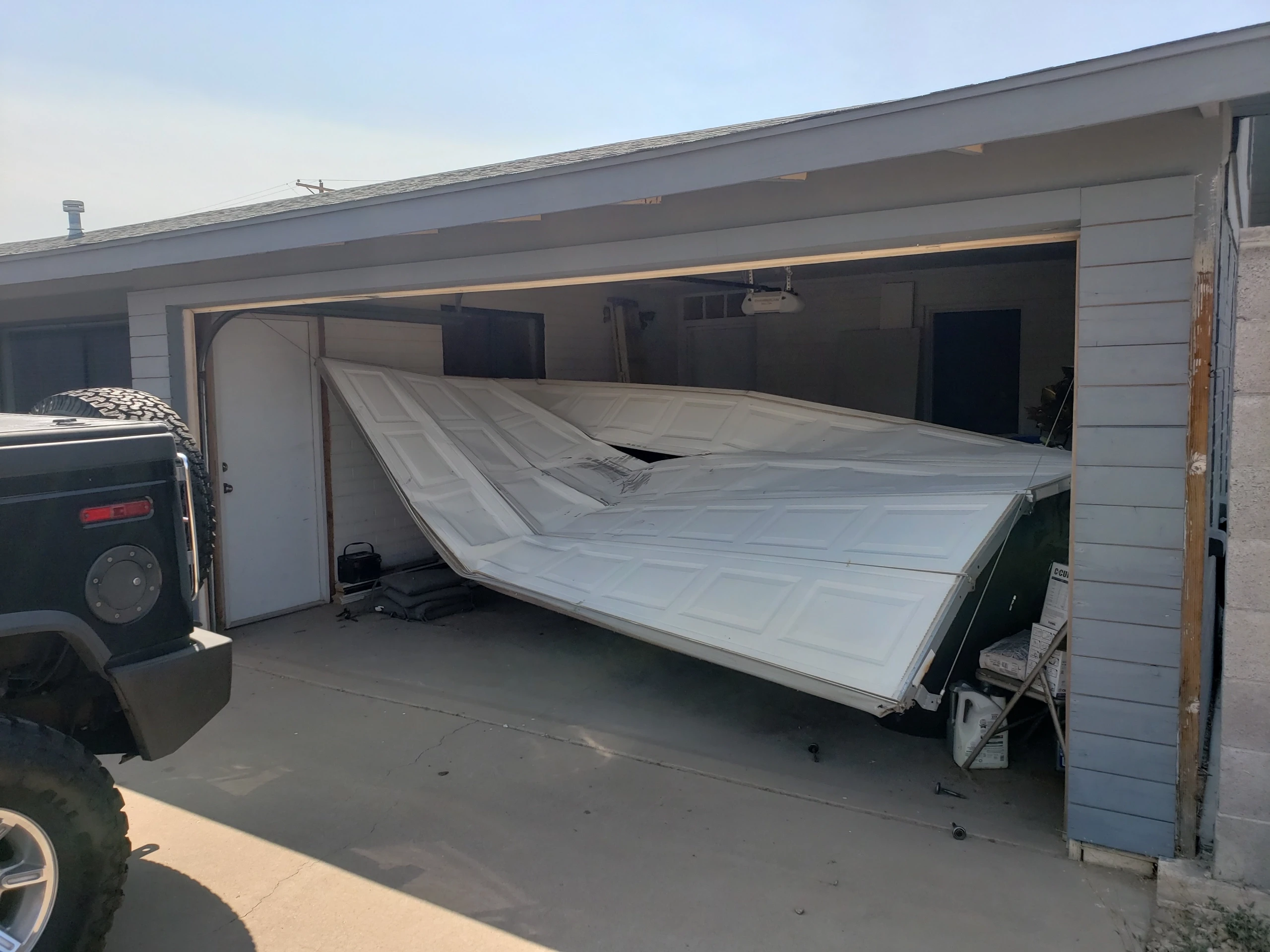 Broken garage door on a residential house