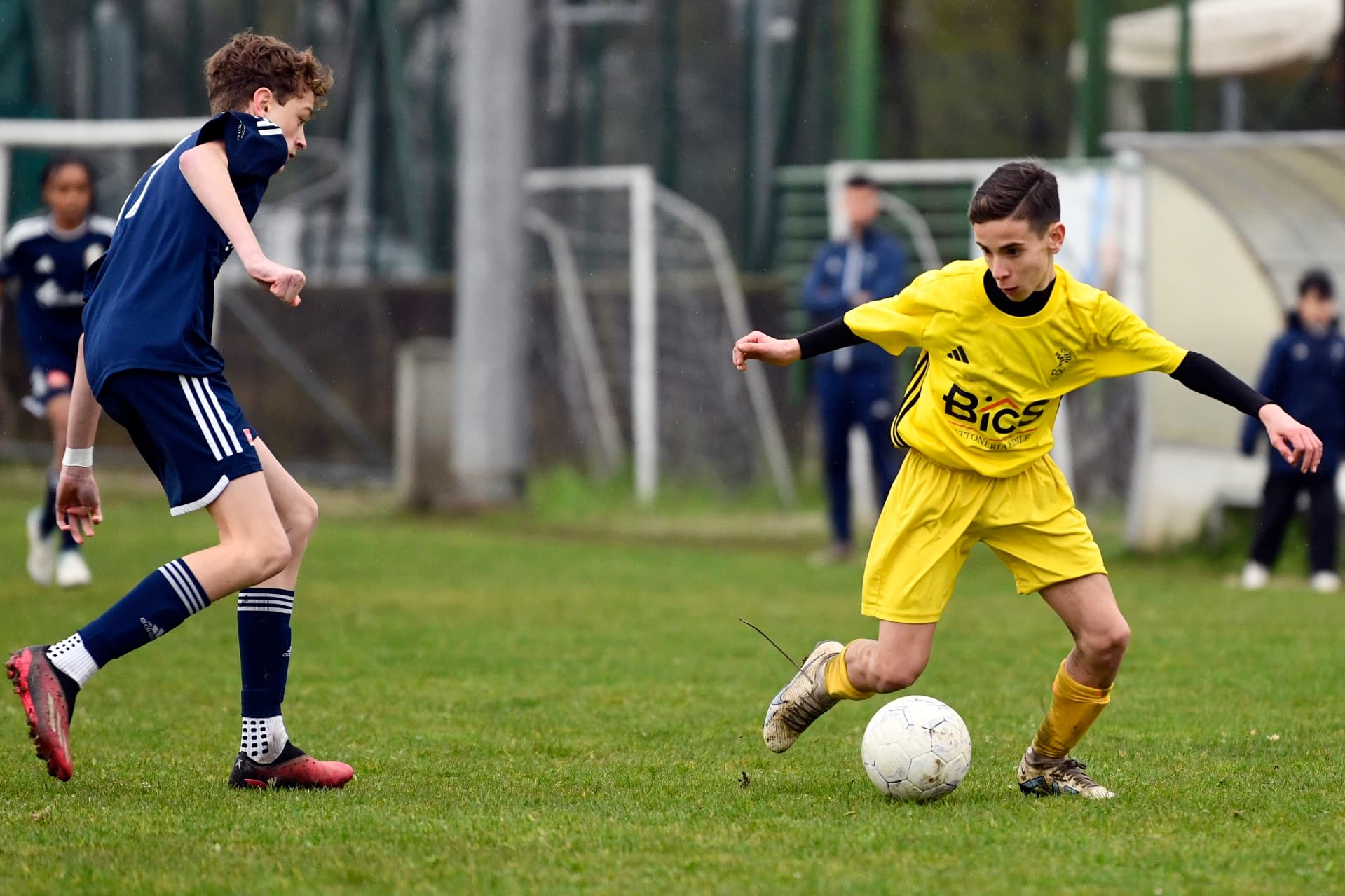 Two Boys playng soccer during a Pianet Sport play