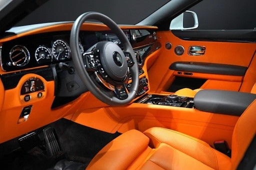 Rolls-Royce Ghost 2023 orange leather front interior seats handcrafted luxury cabin for VIP car rental
