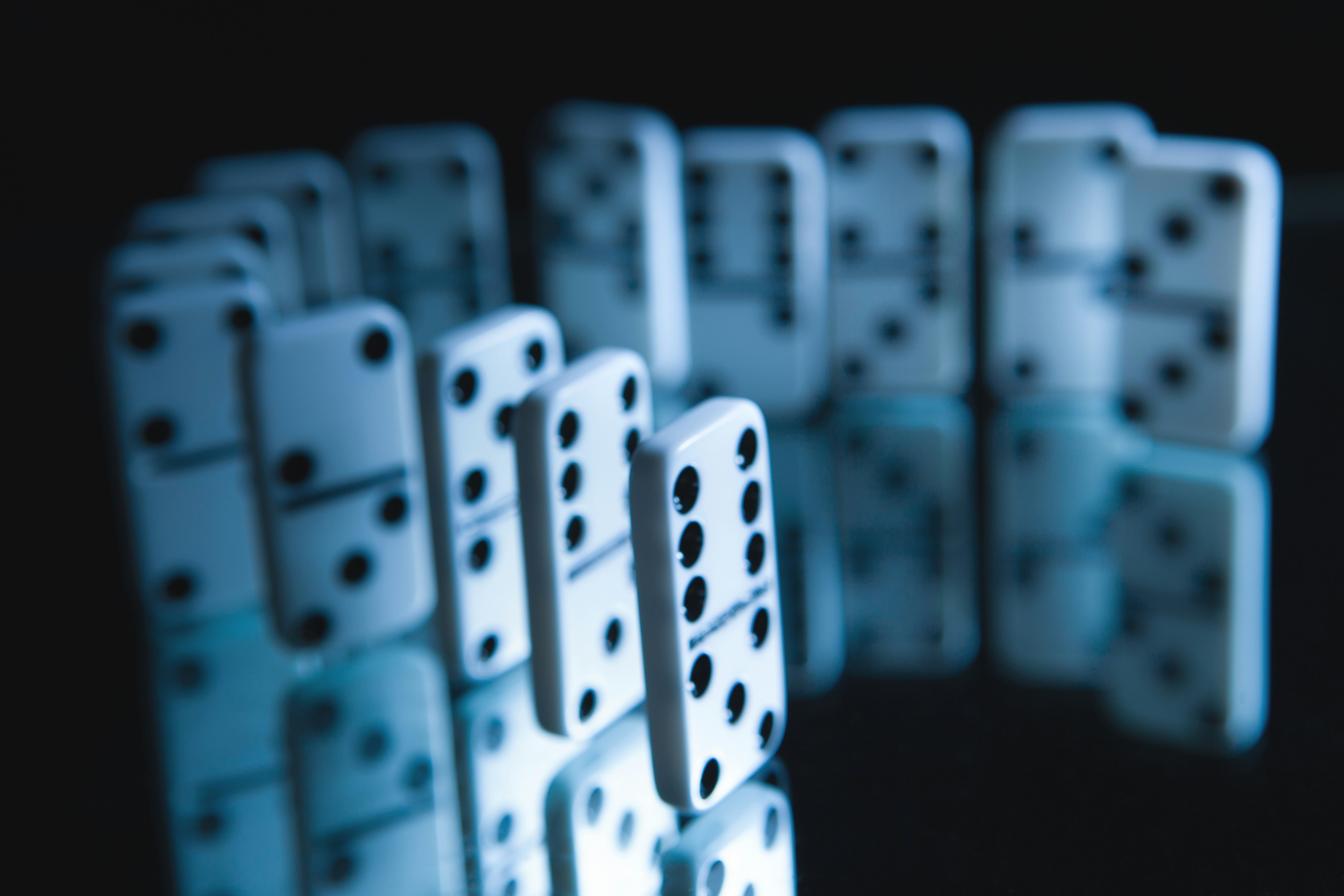 White dominoes arranged in a curved line