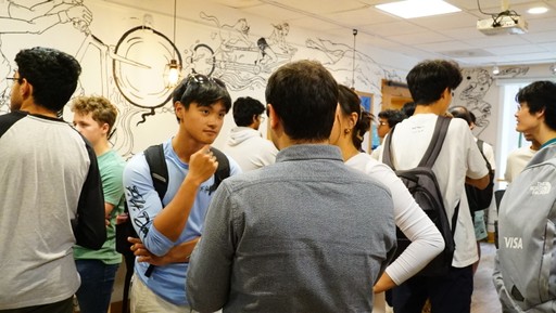 A student listening intently in a conversation.