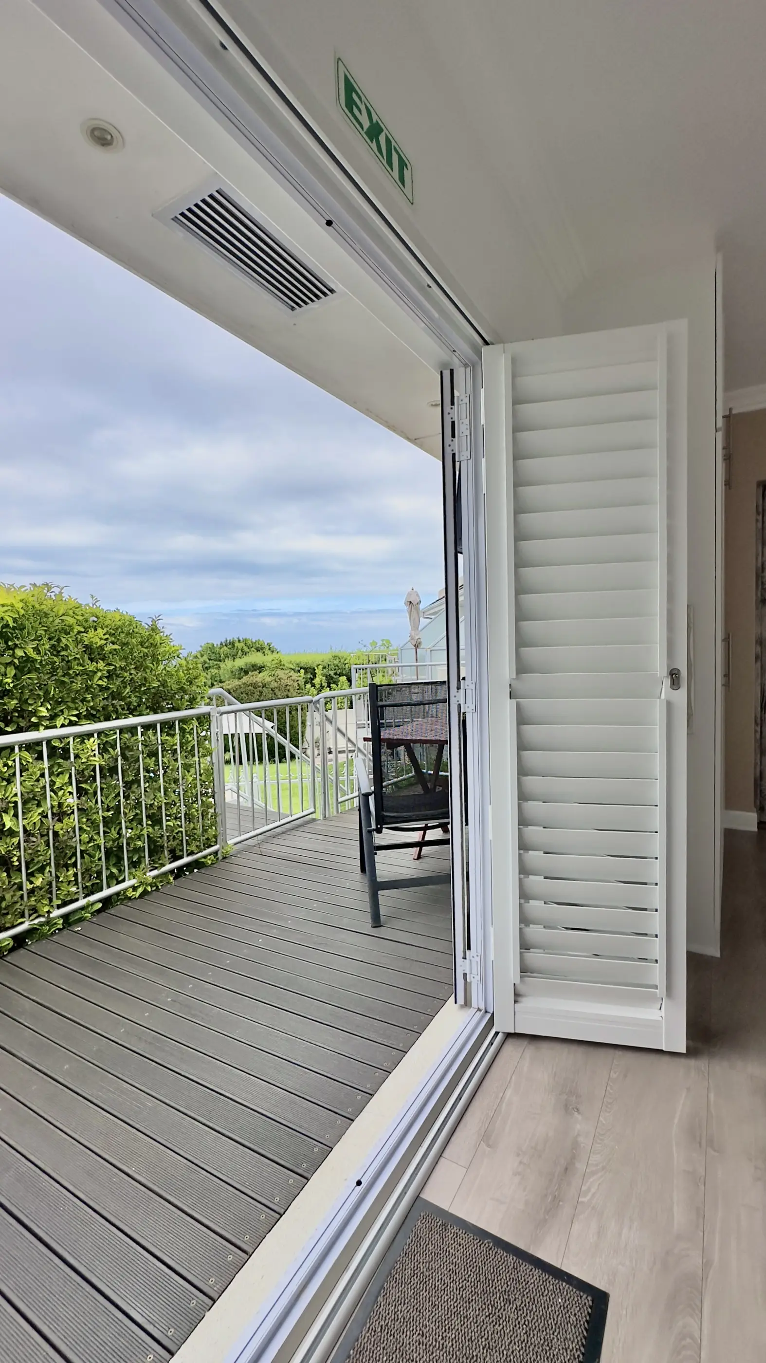 View outside the side door of the room onto the balcony.