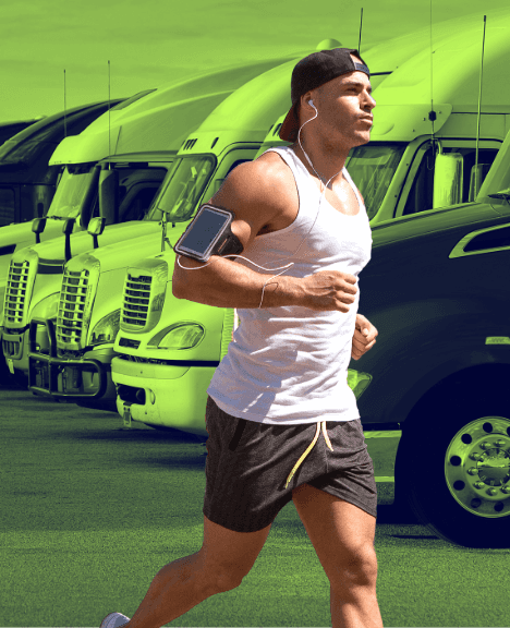 Truck driver jogging at truck stop during his break time. Following the workout from Trucker's Routine.