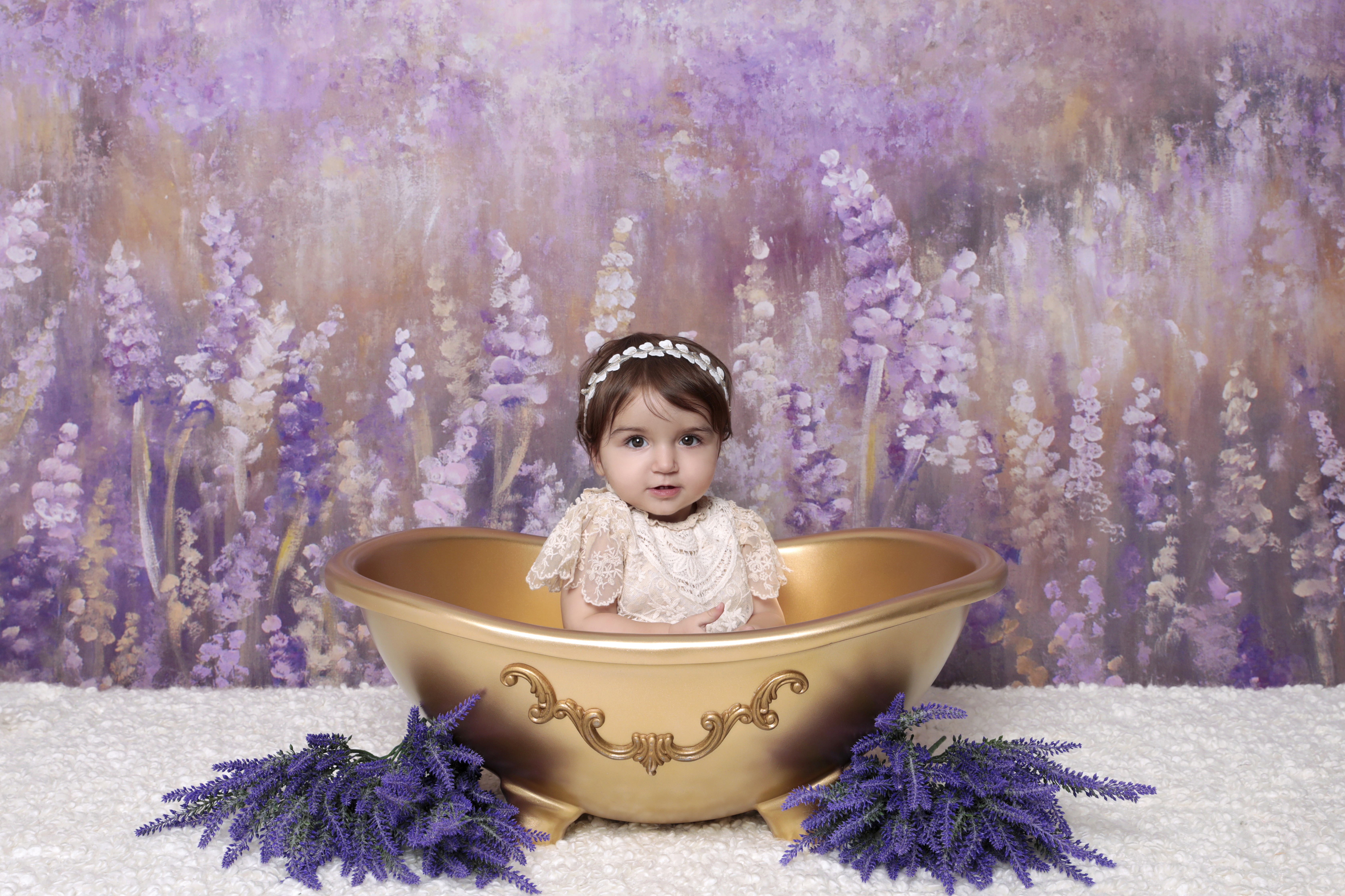 Toddler in gold tub aligned using the rule of thirds.