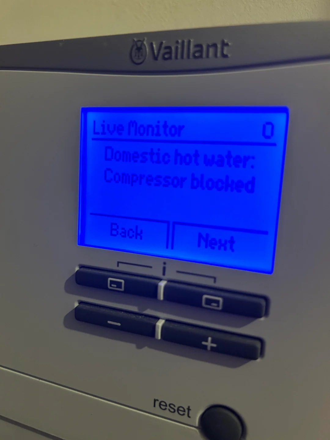 Vaillant aroTHERM heat pump controller displaying Domestic Hot Water Compressor Blocked fault code