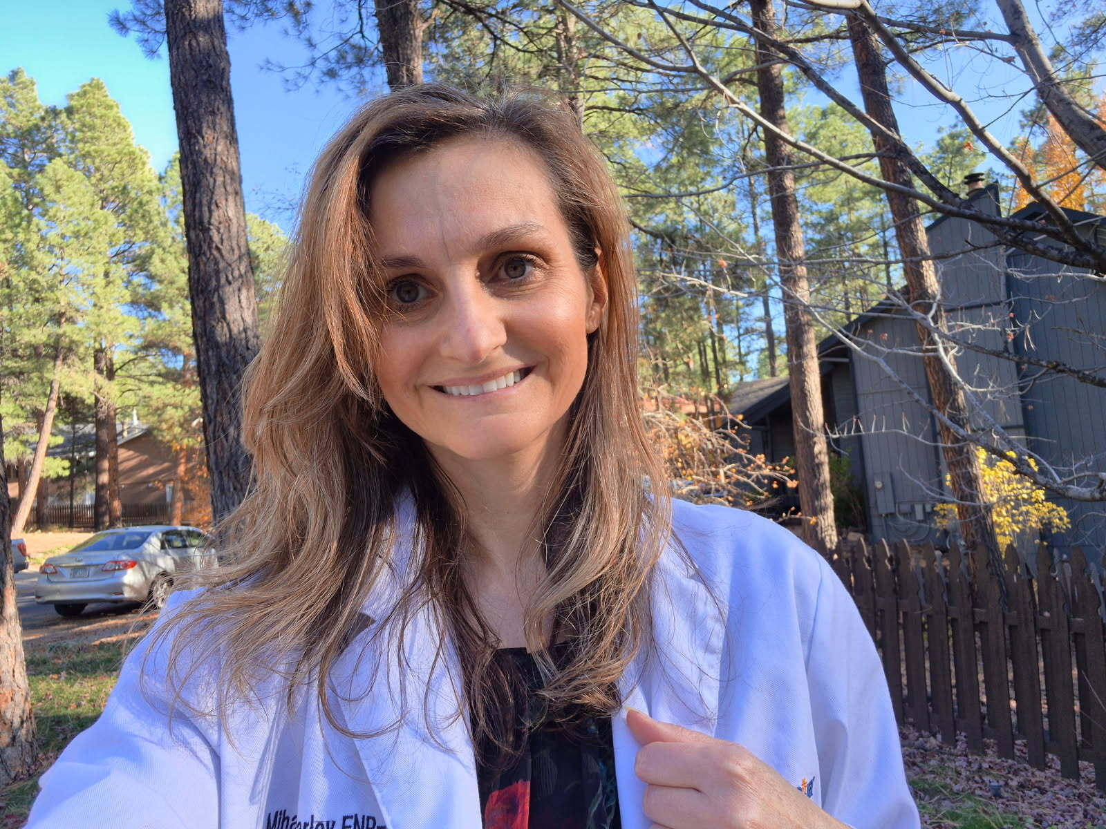 friendly female pediatrician touches shoulder teenage