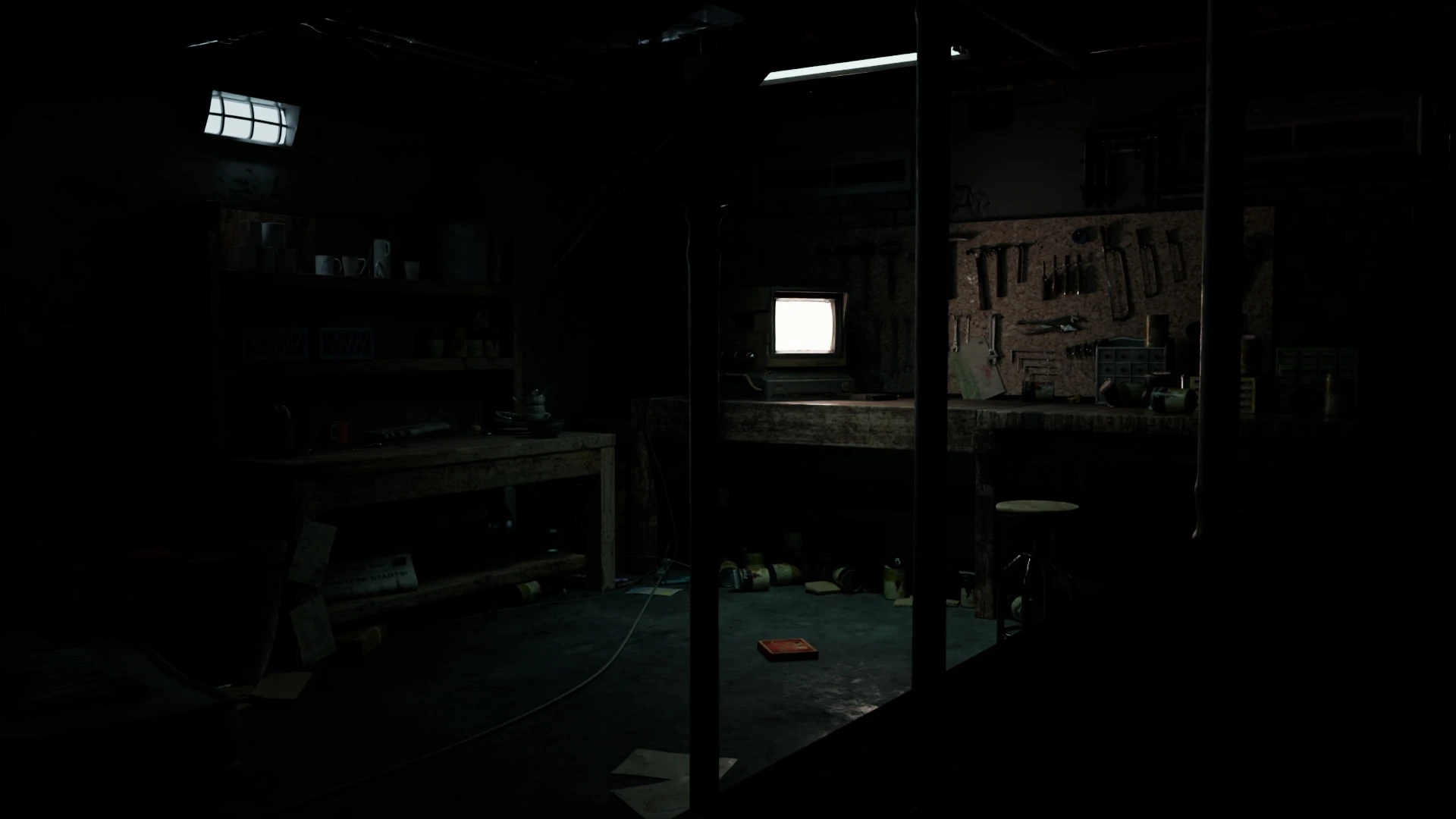 Rendering of a messy basement hobby room at night