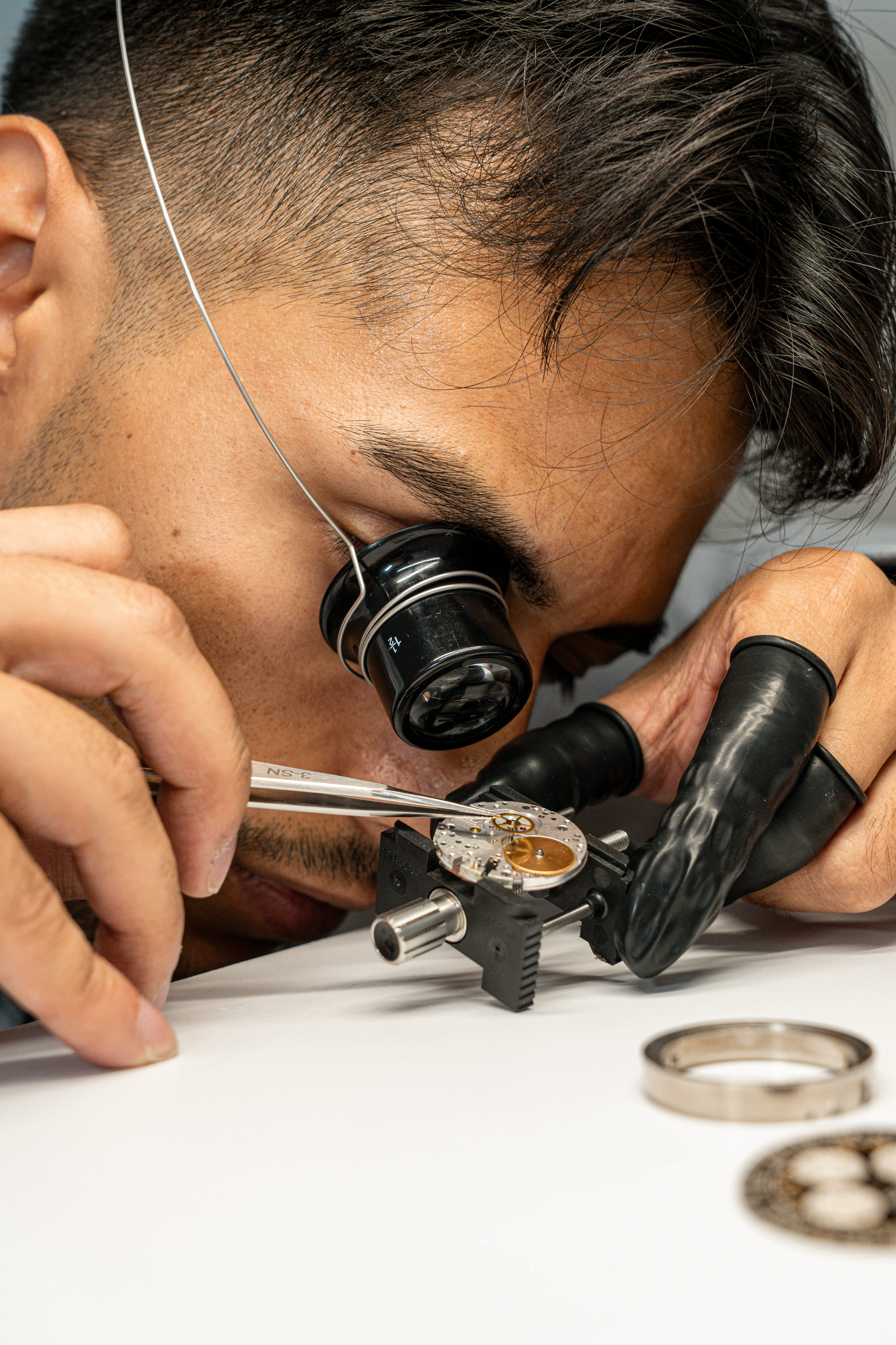 silver and gold round analog watch at 10 10
