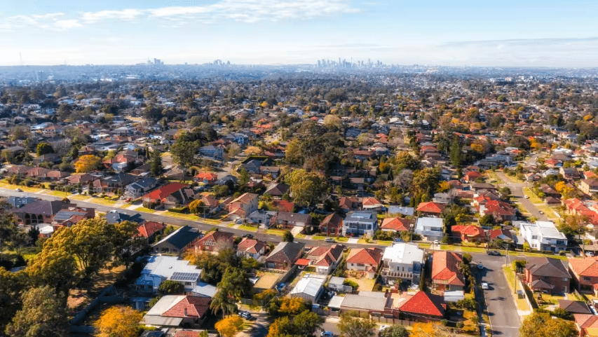 Residential neighborhood with a distant city skyline