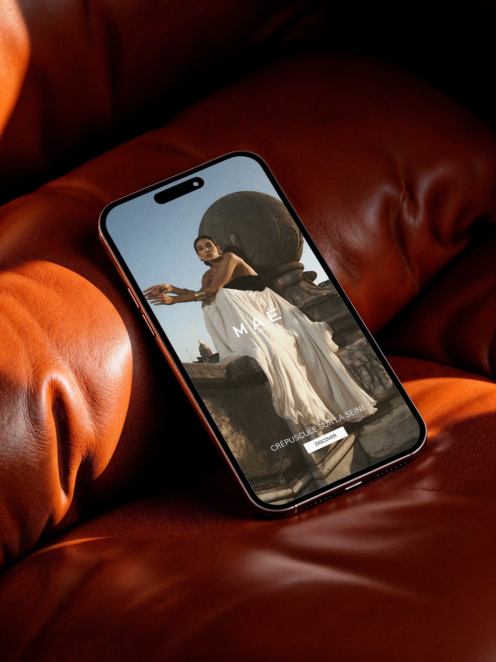 MAË PARIS fashion campaign displayed on a smartphone mockup with luxury editorial photography