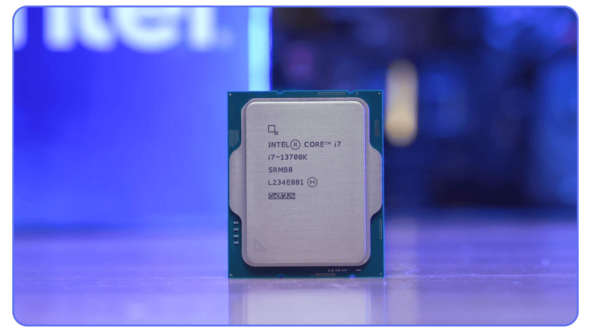 A close-up shot of the Intel Core i7-13700K processor with a blurred blue background.