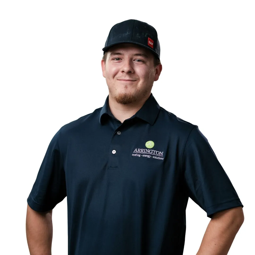 Young man wearing Abbington HVAC logo polo and baseball cap, smiling