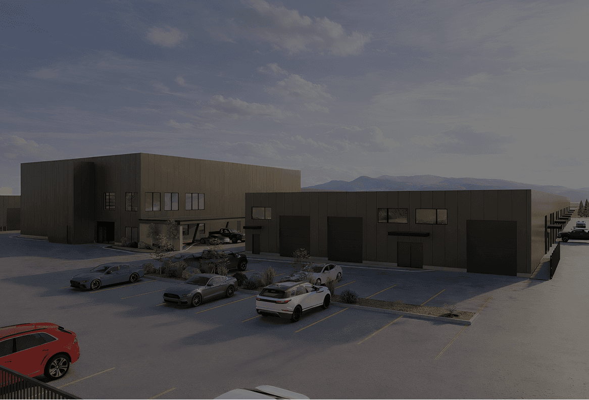 Rear aerial shot of the Eveso site, showing private garage entrances, the side of the members club building, the parking lot with landscaping
