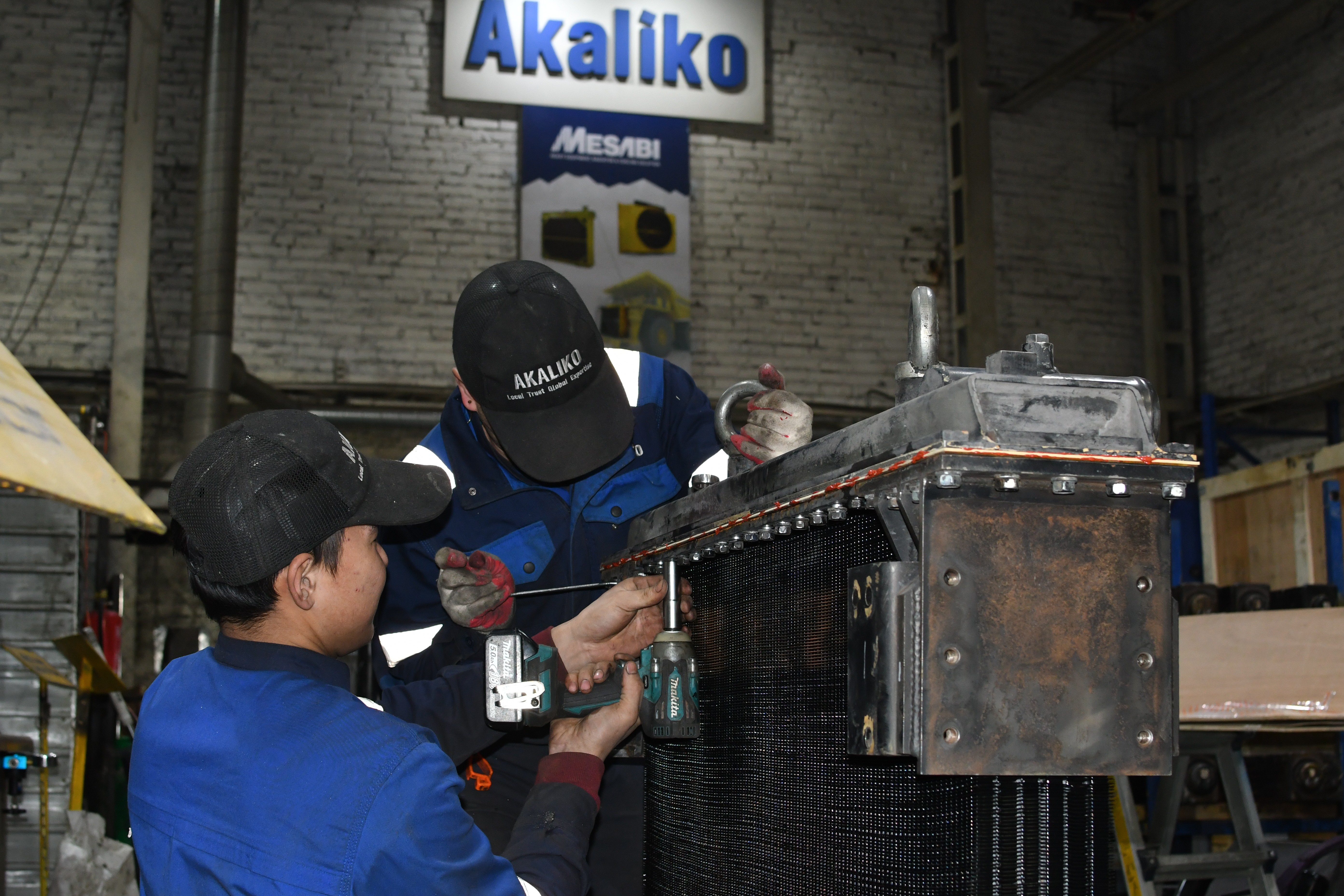 Aerial view of winding lake surrounded by dense forest
