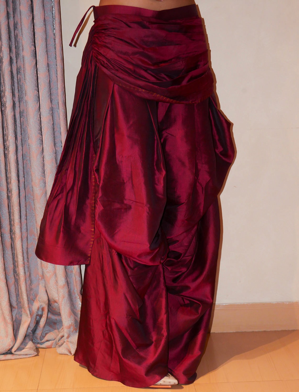 Antariya is our one-of-a-kind drape pants, designed with asymmetrical tucks and fluid folds pinned at varying levels,