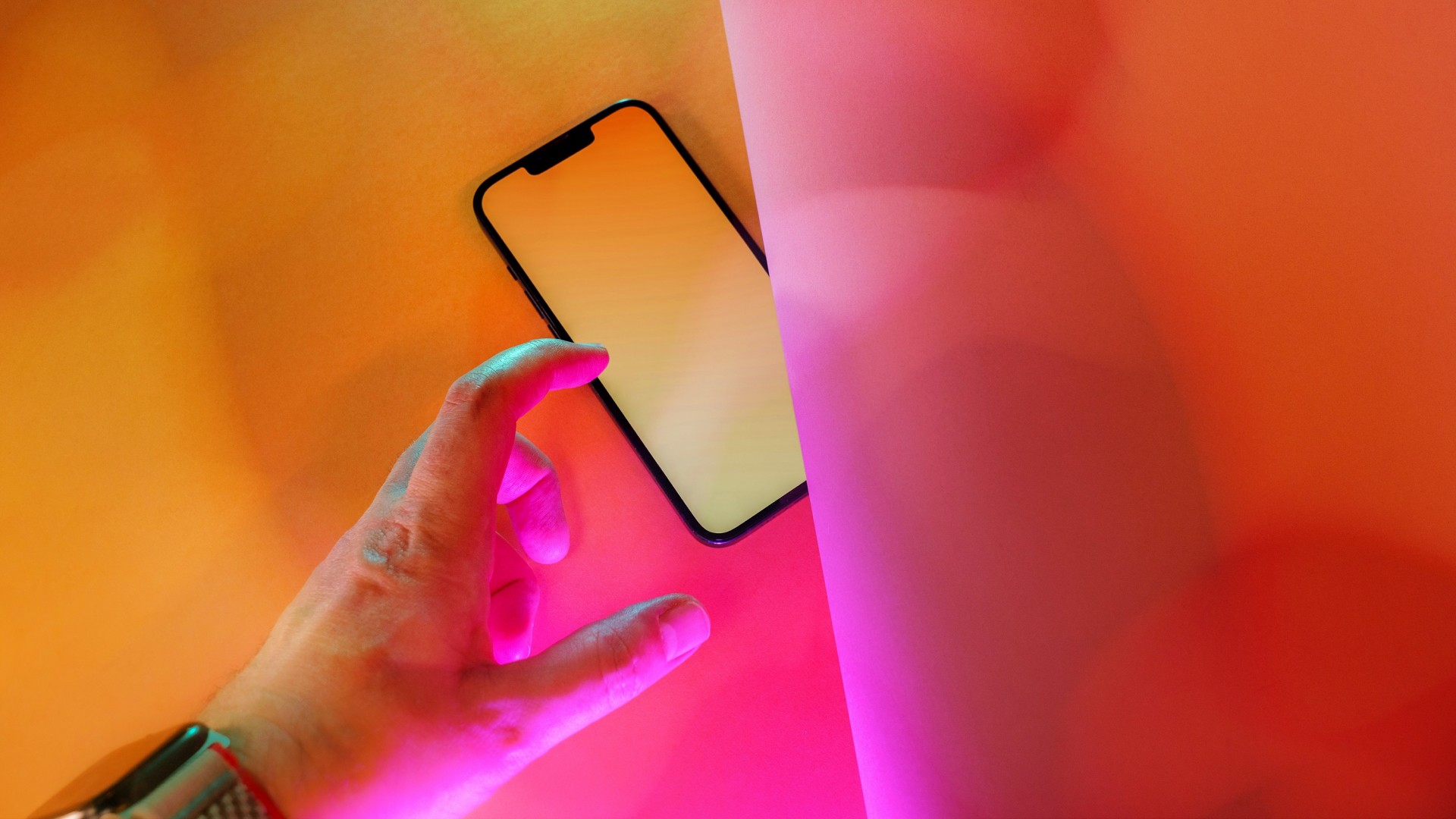 An abstract image of a hand reaching for a mobile phone