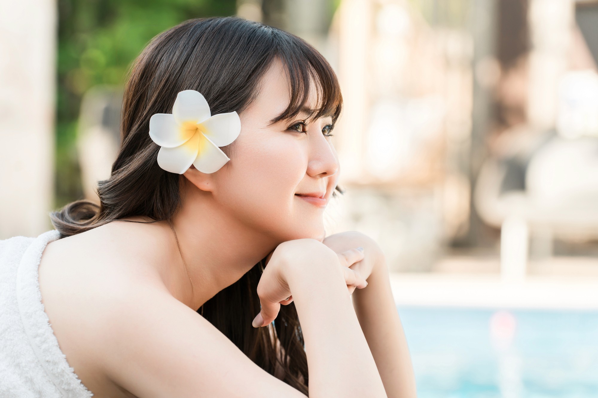 Tropical beach with umbrellas and lounge chairs.