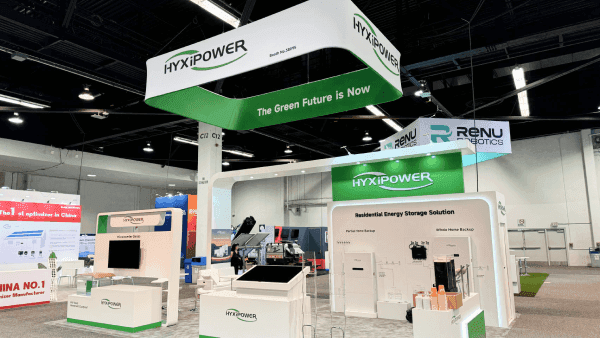High Power RE+ Southeast 2023 battery product booth with energy storage graphics, sample display counters, technical explanation wall, and clean energy buyer discussion area
