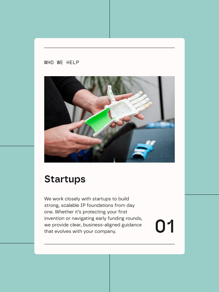 A person writing in a notebook at a table with a glass of water, lit by natural sunlight.