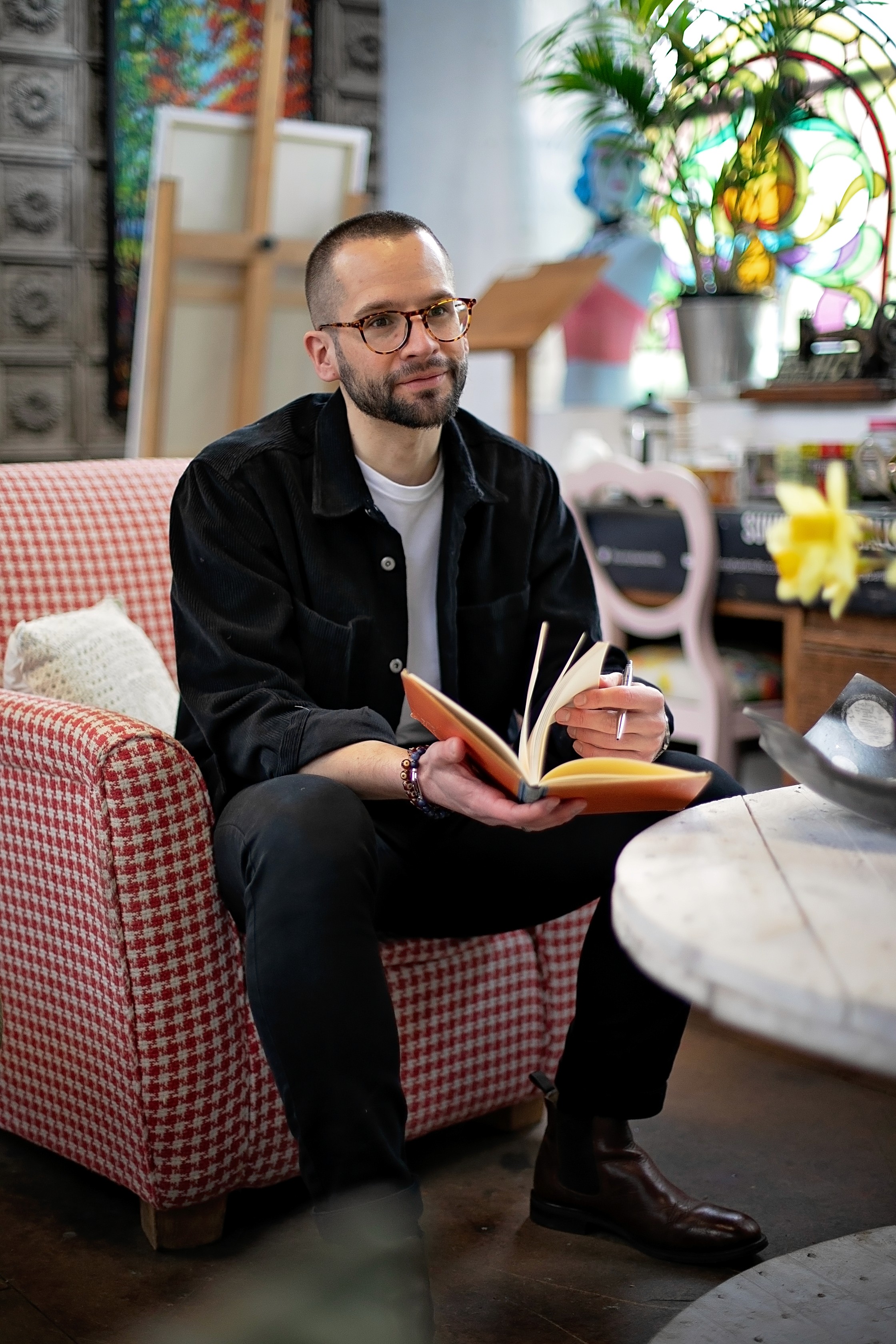 Chris Mitchell, ADHD coach in Leeds, at a cafe during a discovery call session