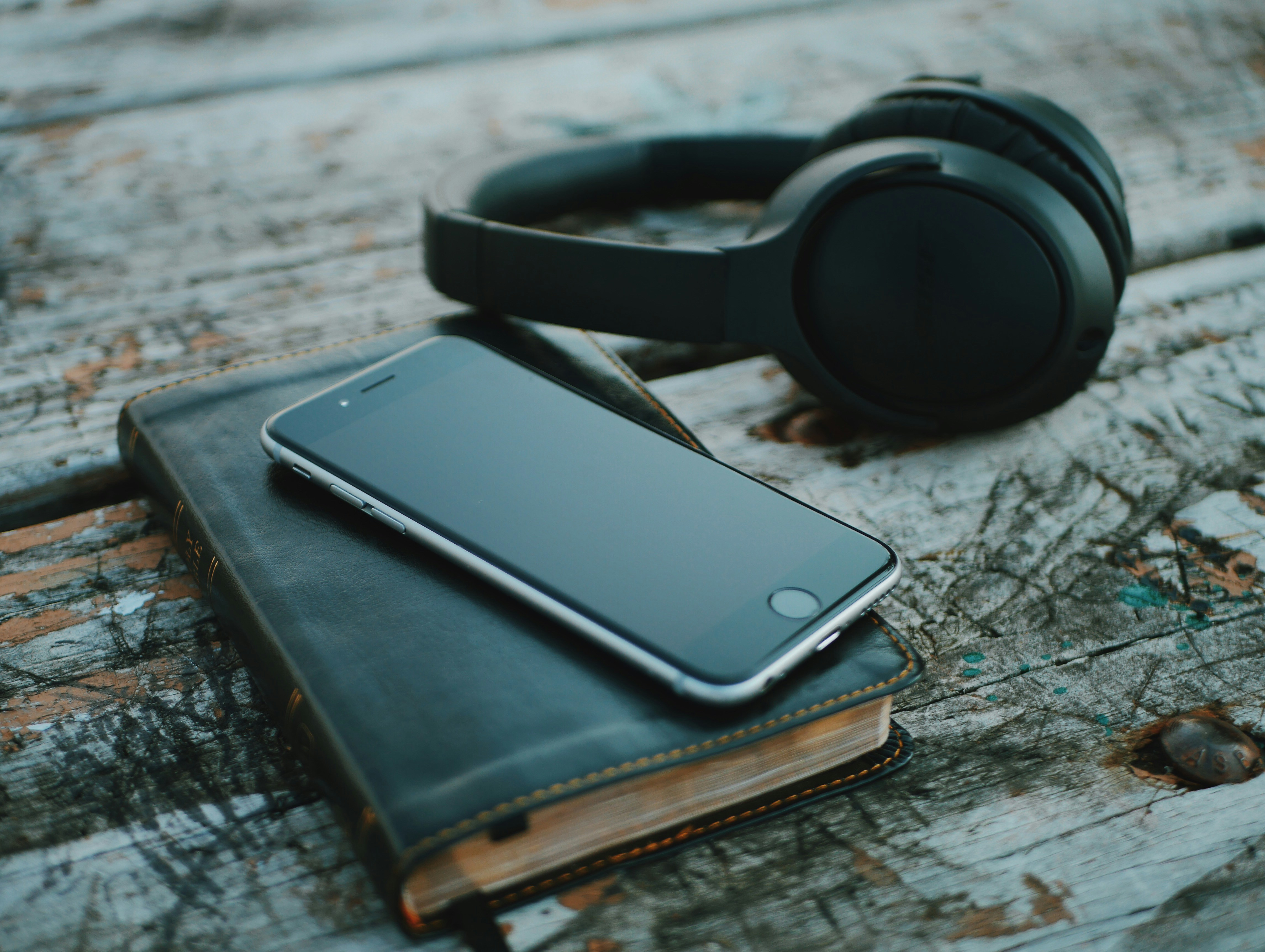 Mobile, Headphone, and Book Placed on Table - PDF to Audiobook