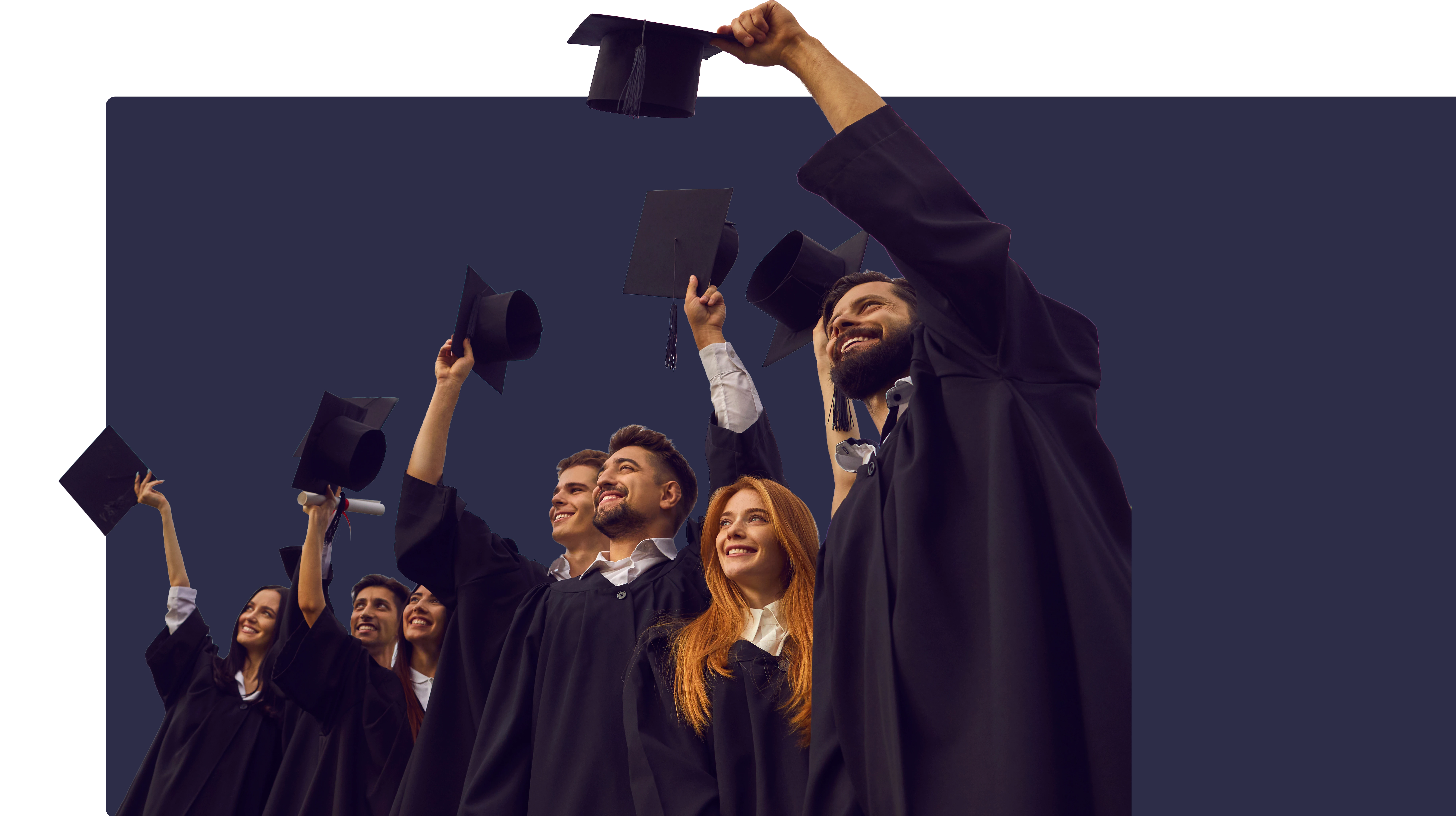 Graduates celebrating and throwing caps in the air
