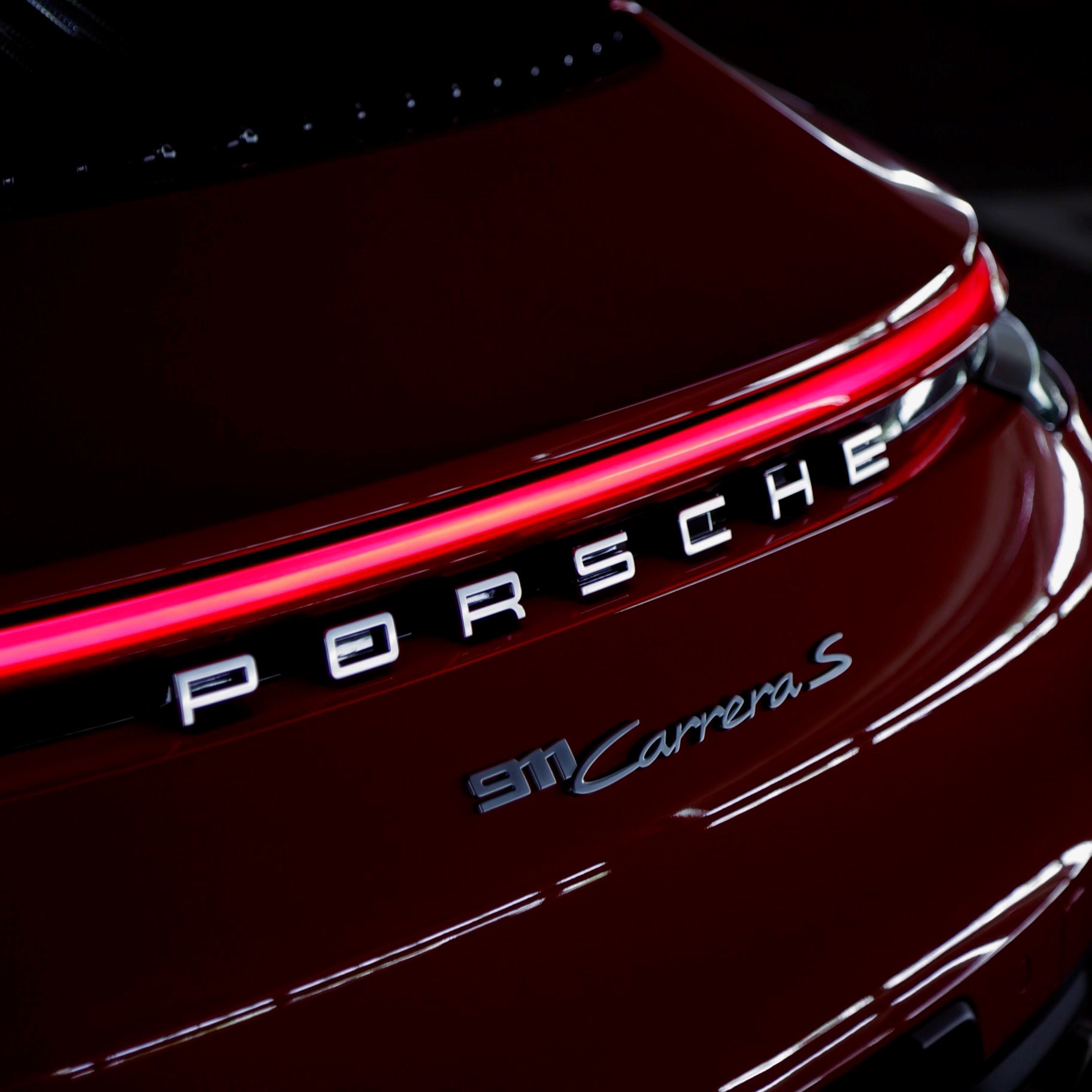 Elegant Porsche 911 Carrera S with its sleek design and advanced aerodynamics, displayed in a sophisticated Miami environment – great for exotic car rental Miami.