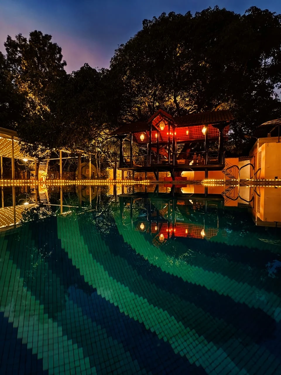 Poolside deck at Amore Collective during evening hours
