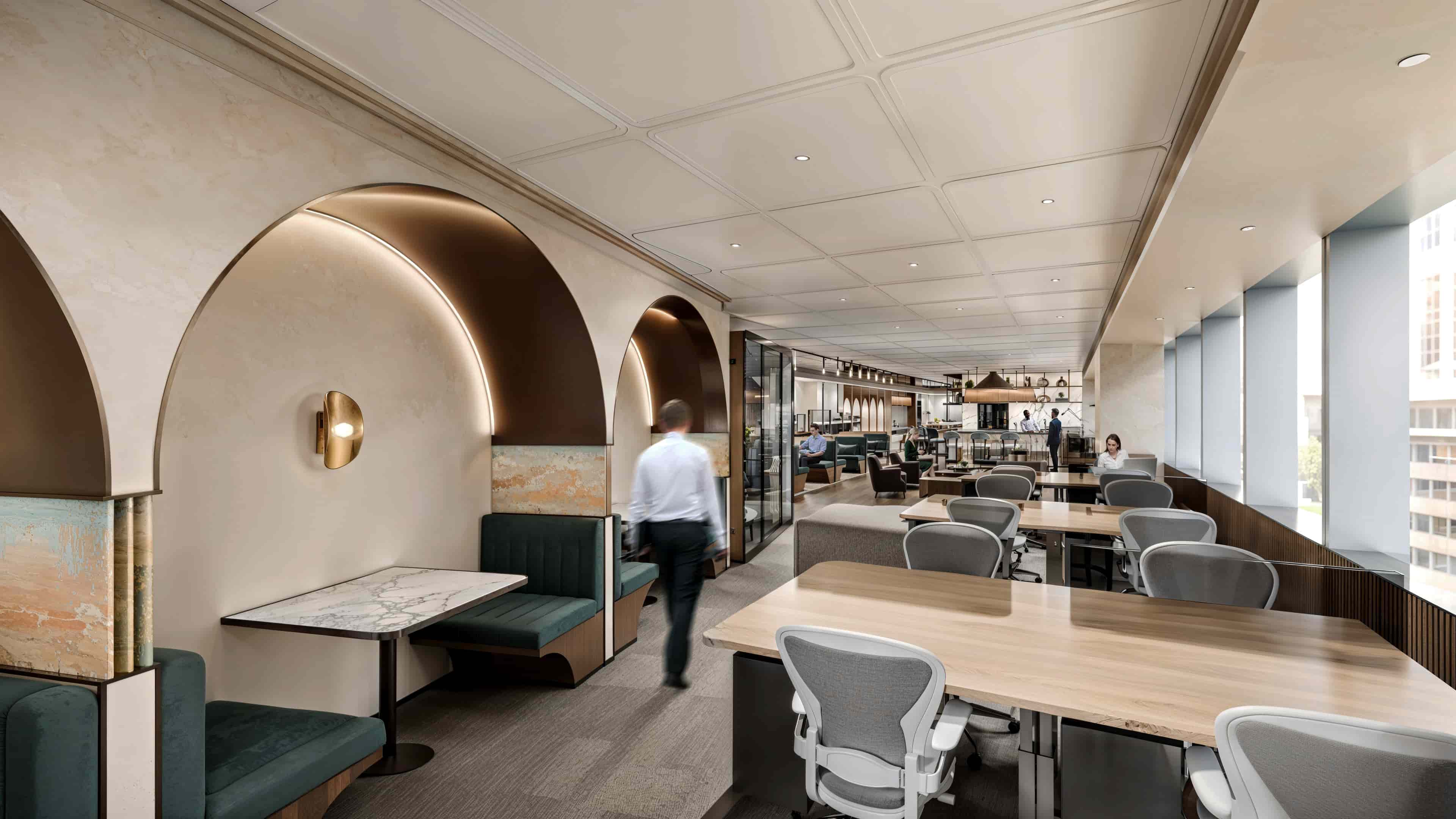 Modern coworking space with shared desks, lounge seating and floor-to-ceiling windows&nbsp;
