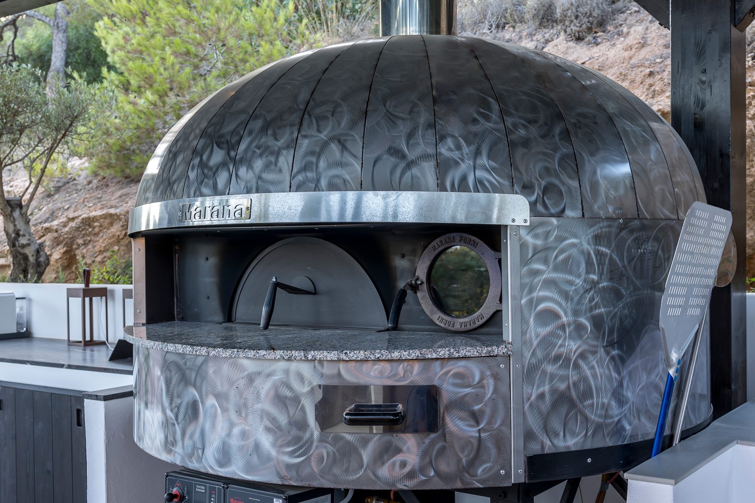 Outdoor pizza oven kitchen at an exclusive luxury villa Ibiza—private VIP estate property wedding events holiday retreat