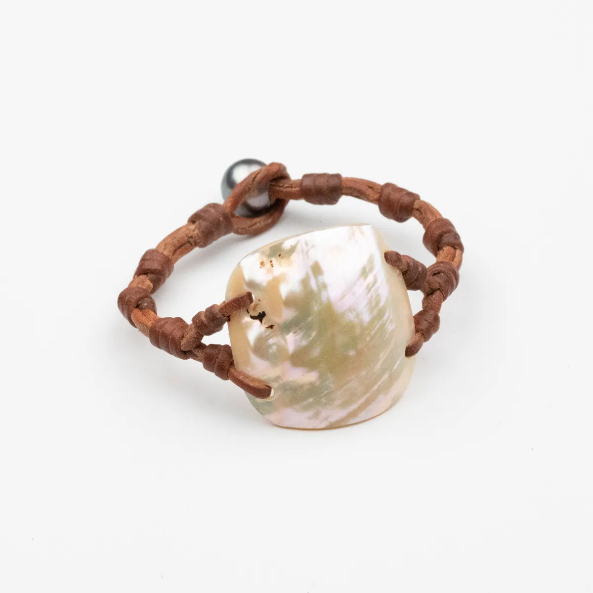 Seashell and Tahitian Pearl bracelet on knotted brown leather cord with pearl closure — Manos de Oro Saint Barth
