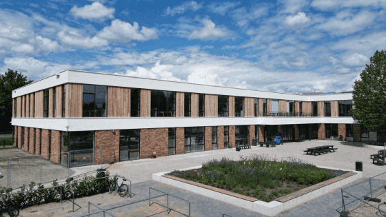 Portrait shot of a woman in a yoga outfit.