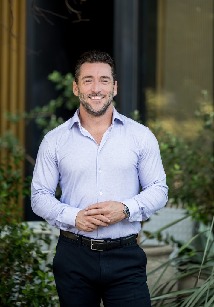 person sitting in a chair in front of a man