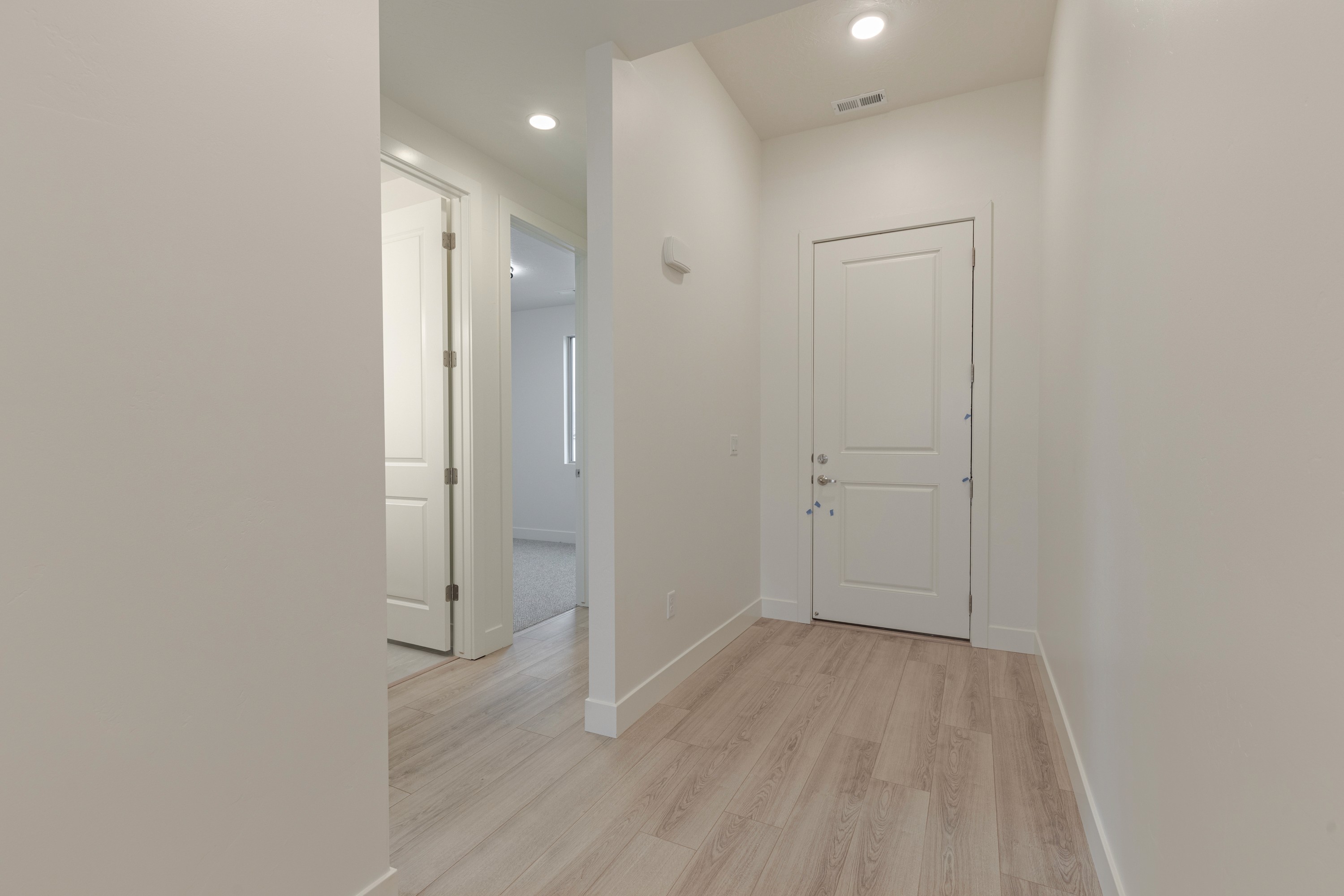 Interior entry of the Painted Sands twin home in Hurricane, Utah featuring a welcoming layout and clean design.
