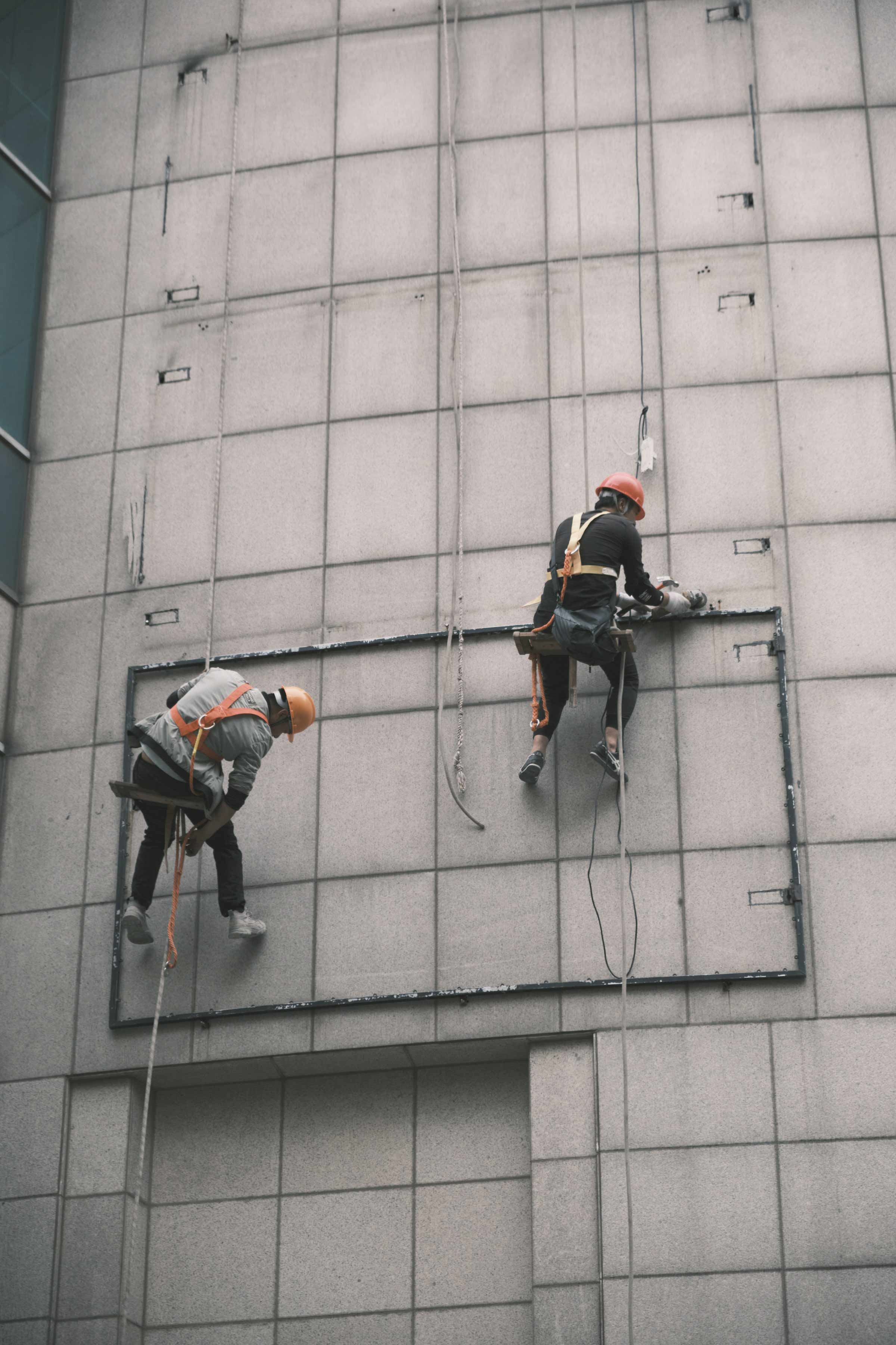 man standing beside train rail