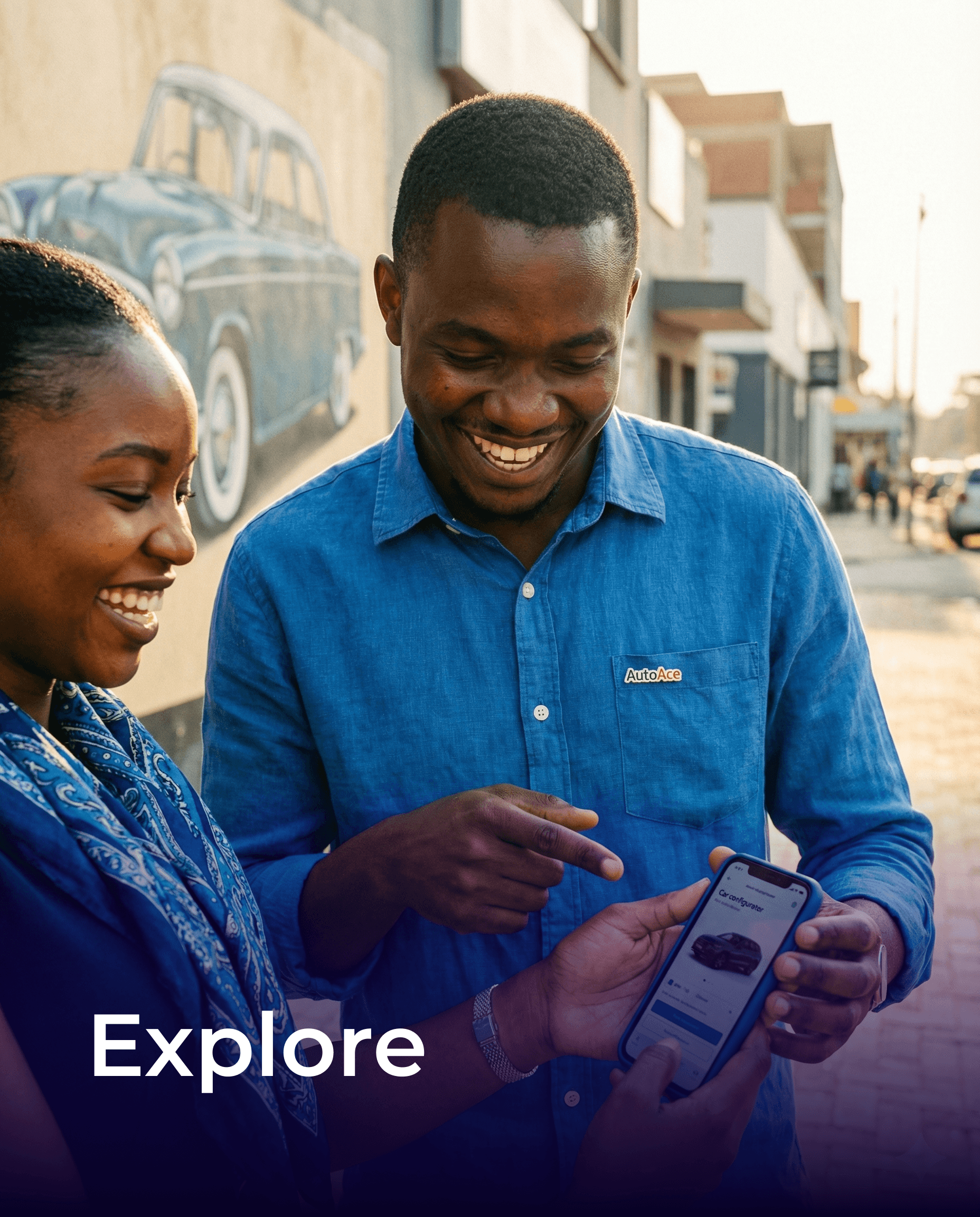 A smiling woman with her arms crossed, standing against a dark green background. She has long, dark hair.