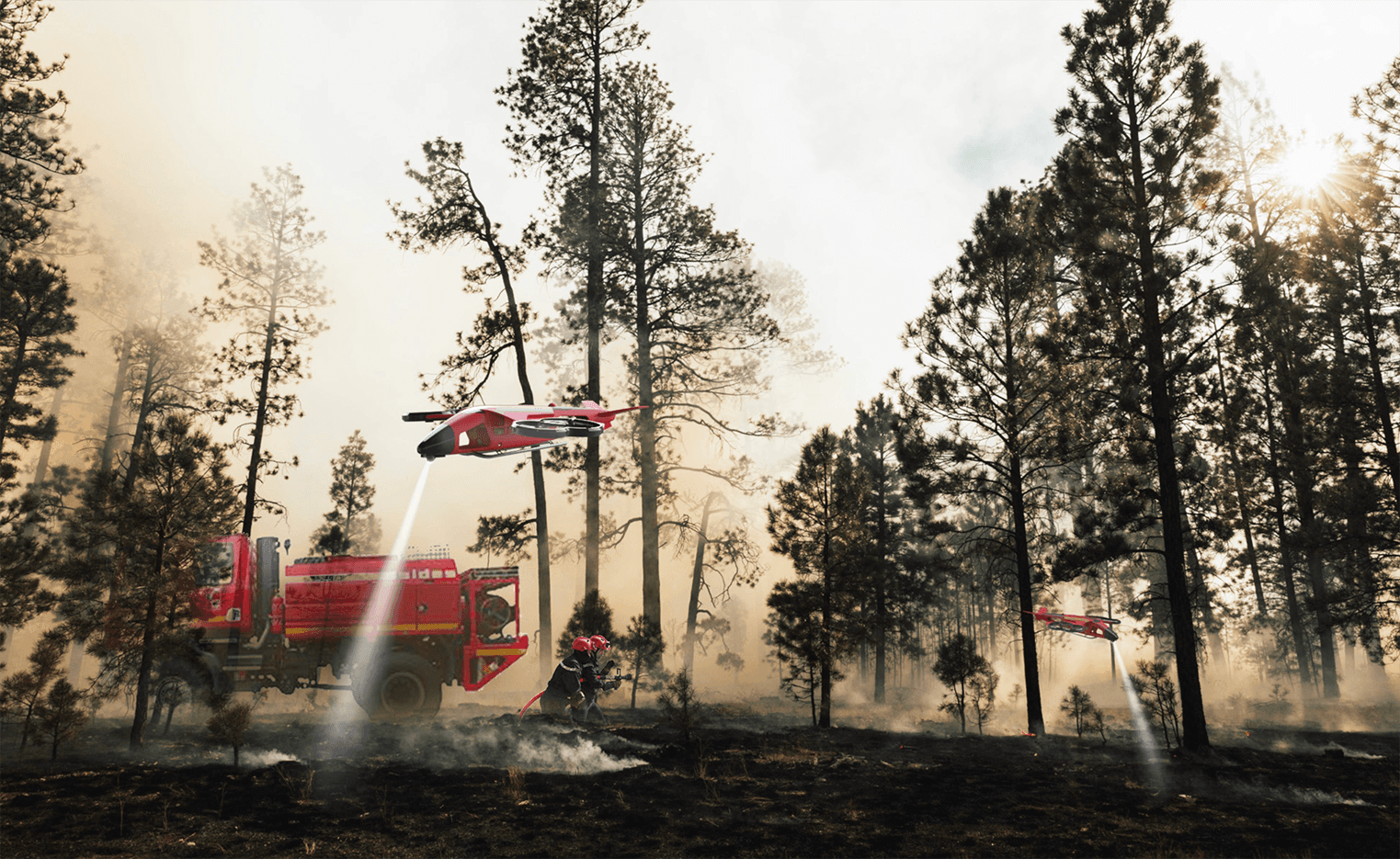 Conceptual rendering showing the firefighting drone system in a collaborative scene; two drones fly above, providing support and real-time data to firefighters and a fire truck on the ground.