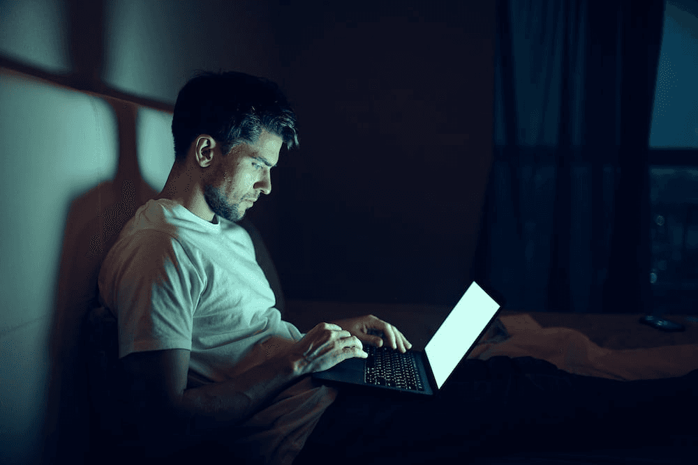Man Using Laptop alone - Does Porn Make You Lazy
