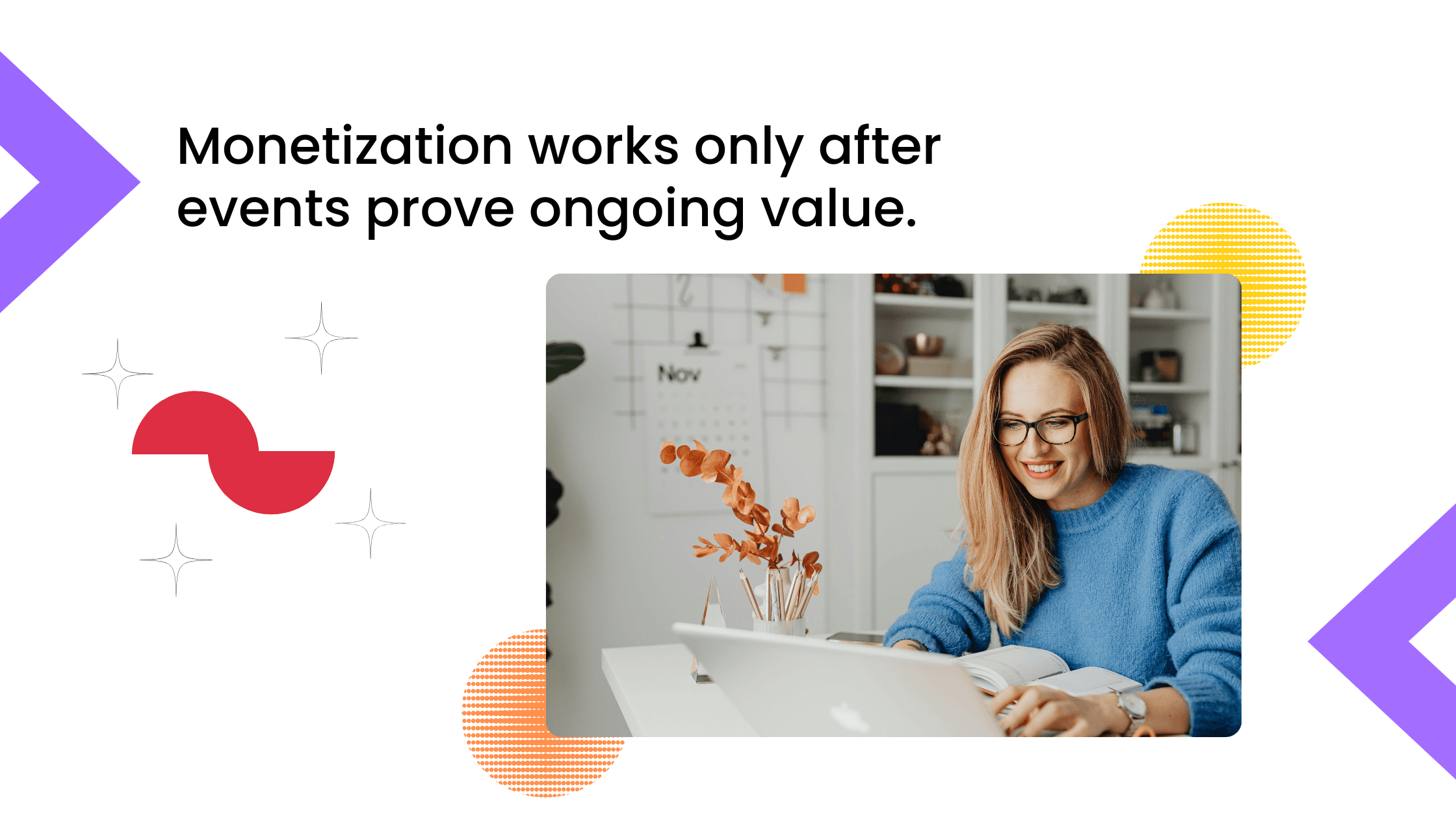 Smiling woman wearing glasses working on a laptop at a desk in a bright home office.