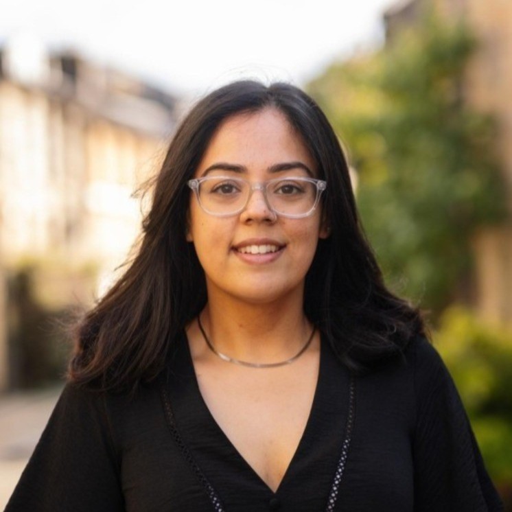 A professional headshot of Sidrah Hassan