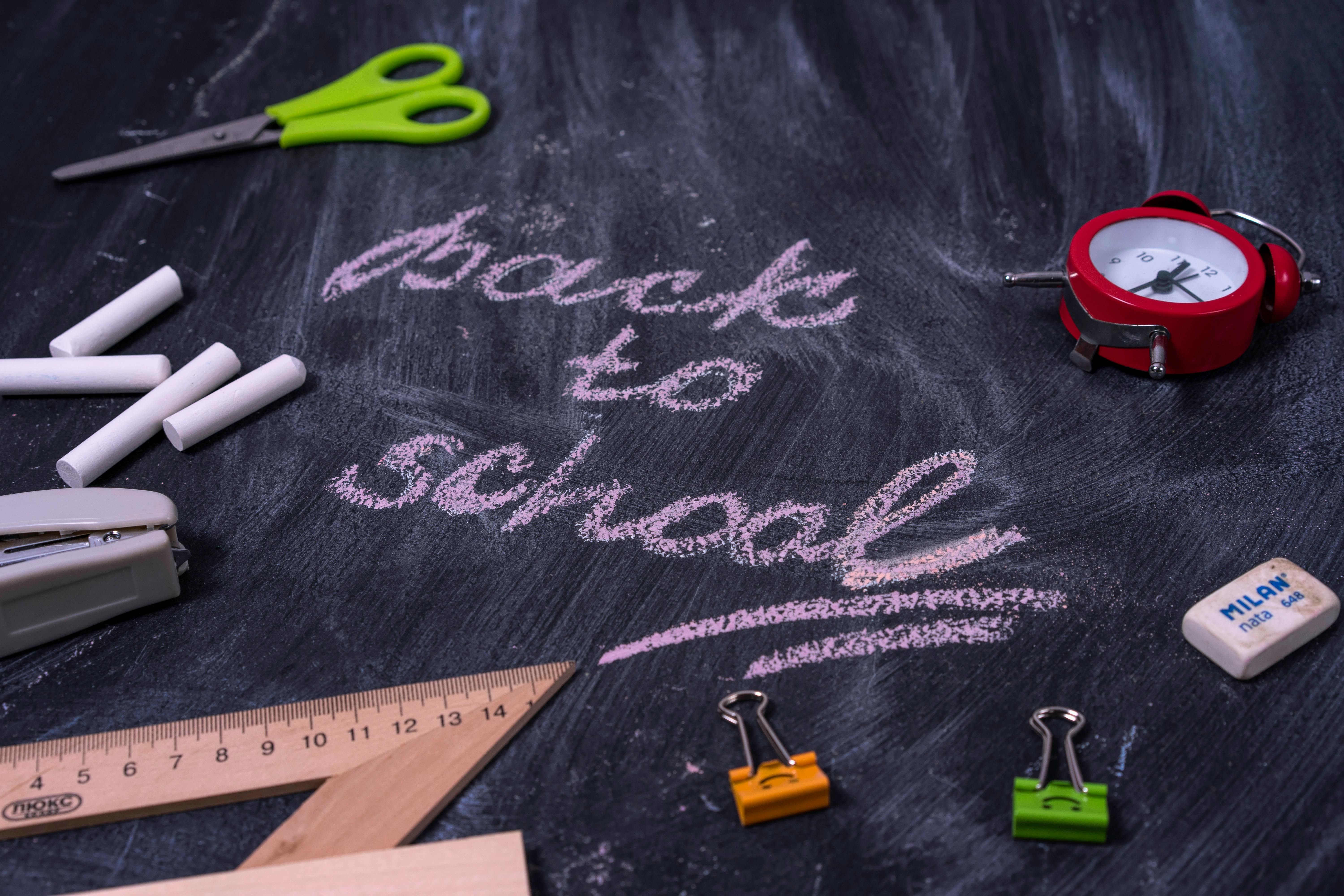 Green and Gray Scissors, tools and cool supplies over a gray background