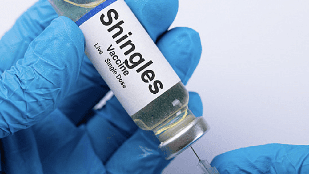 lady in white dress shirt holding white box